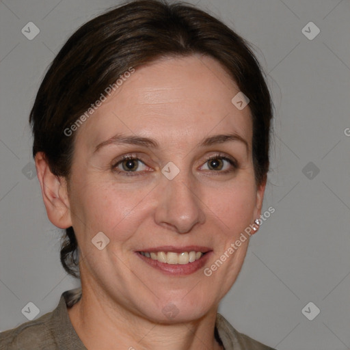 Joyful white adult female with medium  brown hair and brown eyes