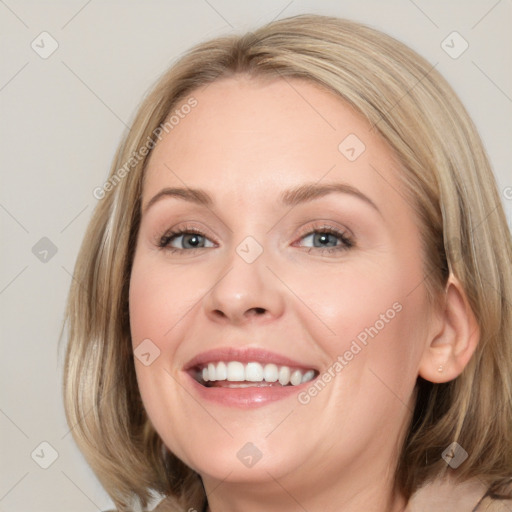 Joyful white young-adult female with medium  brown hair and blue eyes