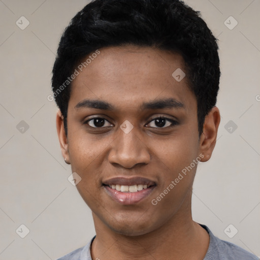 Joyful black young-adult male with short  black hair and brown eyes