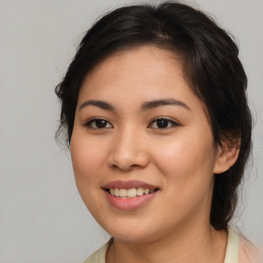 Joyful asian young-adult female with medium  brown hair and brown eyes