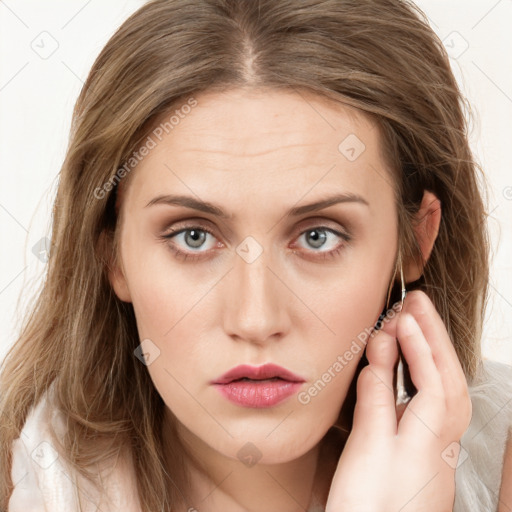 Neutral white young-adult female with long  brown hair and brown eyes