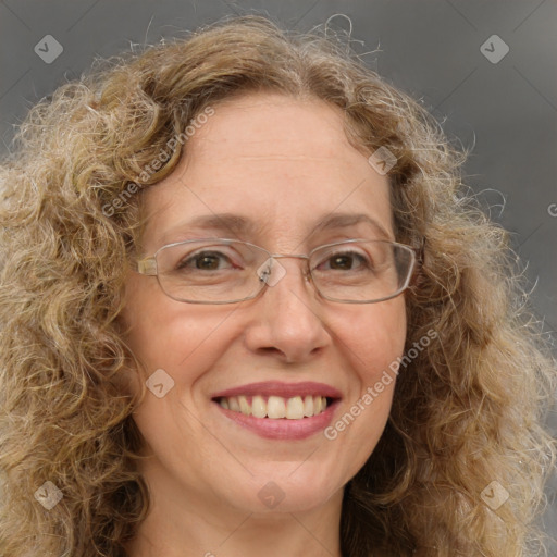 Joyful white adult female with medium  brown hair and green eyes