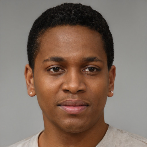 Joyful latino young-adult male with short  brown hair and brown eyes