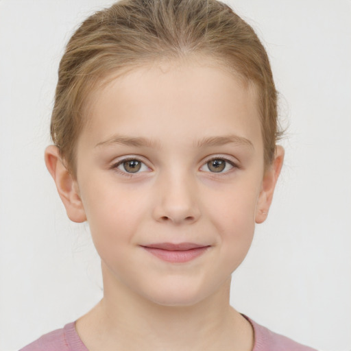 Joyful white child female with short  brown hair and brown eyes