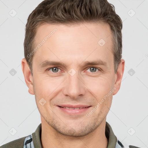 Joyful white adult male with short  brown hair and grey eyes