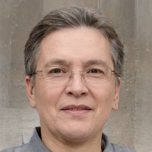 Joyful white middle-aged male with short  brown hair and grey eyes