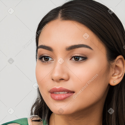 Joyful latino young-adult female with long  black hair and brown eyes