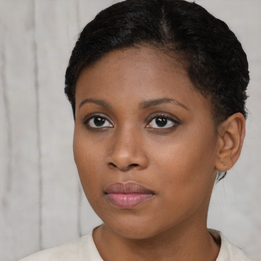 Neutral black young-adult female with short  brown hair and brown eyes