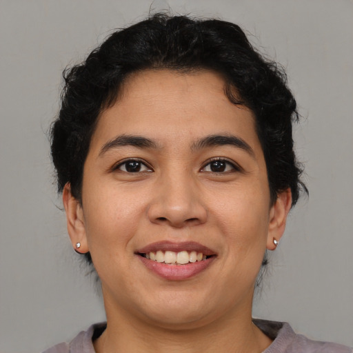 Joyful asian young-adult female with short  brown hair and brown eyes
