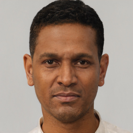 Neutral black adult male with short  black hair and brown eyes