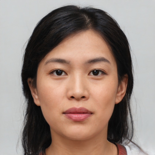 Neutral asian young-adult female with medium  brown hair and brown eyes