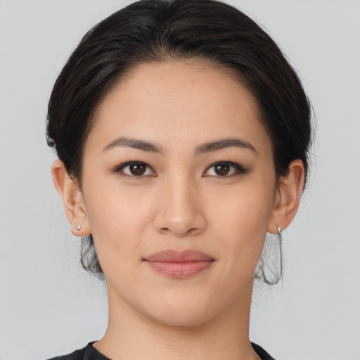 Joyful asian young-adult female with medium  brown hair and brown eyes