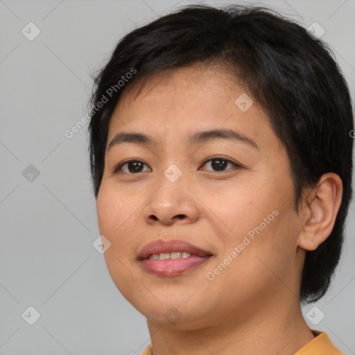 Joyful asian young-adult female with medium  brown hair and brown eyes