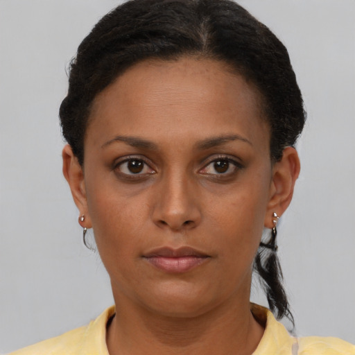 Neutral black young-adult female with short  brown hair and brown eyes