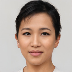 Joyful asian young-adult female with short  black hair and brown eyes