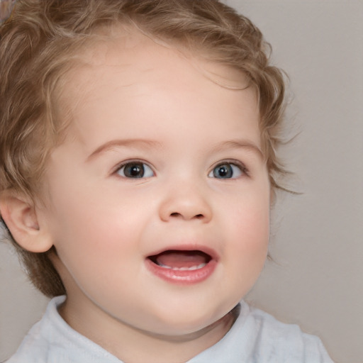 Joyful white child female with short  brown hair and blue eyes