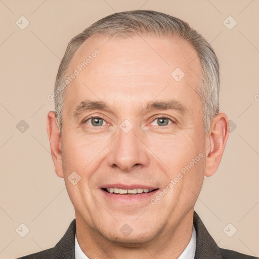 Joyful white adult male with short  brown hair and grey eyes