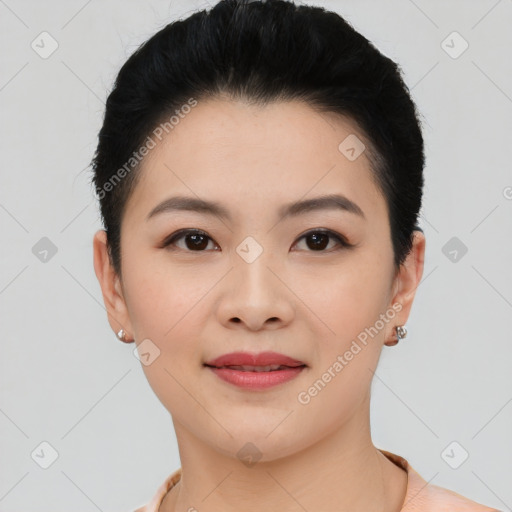 Joyful asian young-adult female with short  black hair and brown eyes