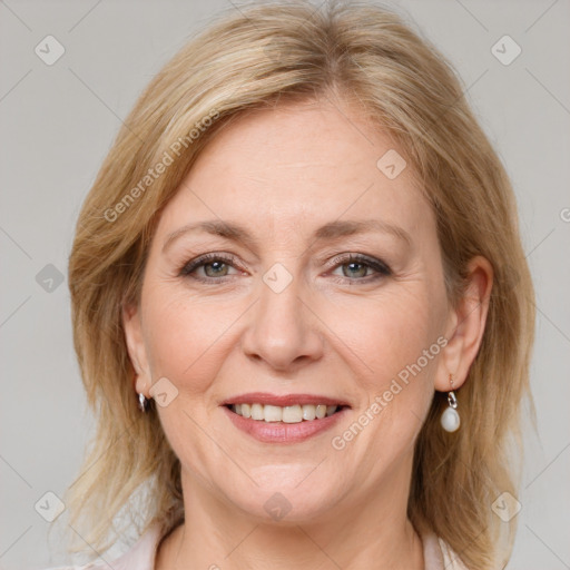 Joyful white adult female with medium  brown hair and grey eyes