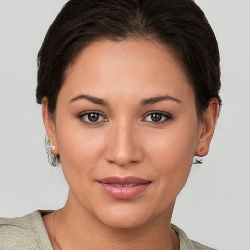 Joyful white young-adult female with short  brown hair and brown eyes