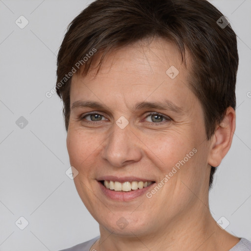 Joyful white adult female with short  brown hair and brown eyes