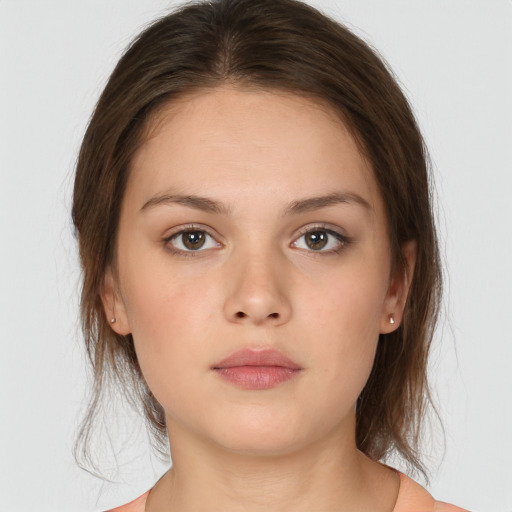 Neutral white young-adult female with medium  brown hair and brown eyes