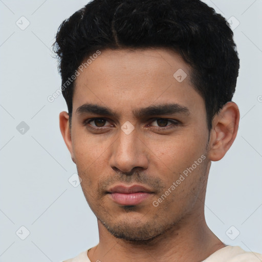 Neutral white young-adult male with short  black hair and brown eyes