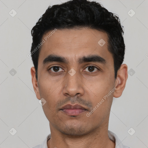 Neutral latino young-adult male with short  black hair and brown eyes