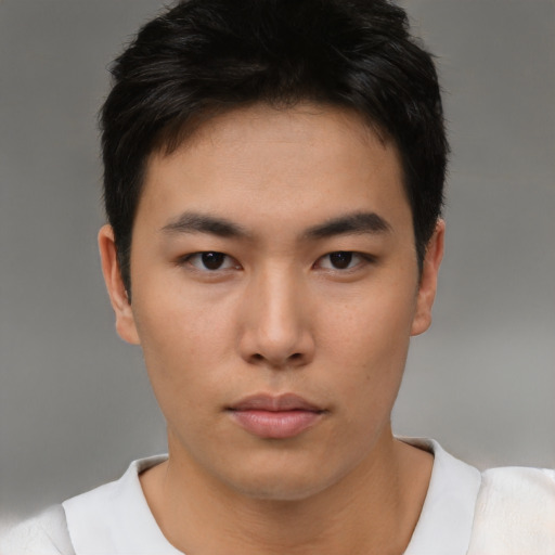 Neutral asian young-adult male with short  brown hair and brown eyes