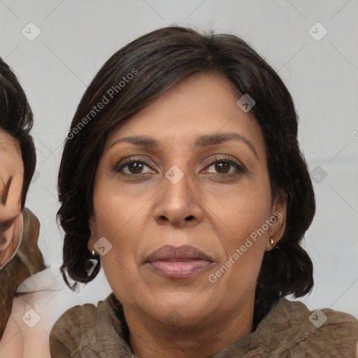 Joyful asian adult female with medium  brown hair and brown eyes