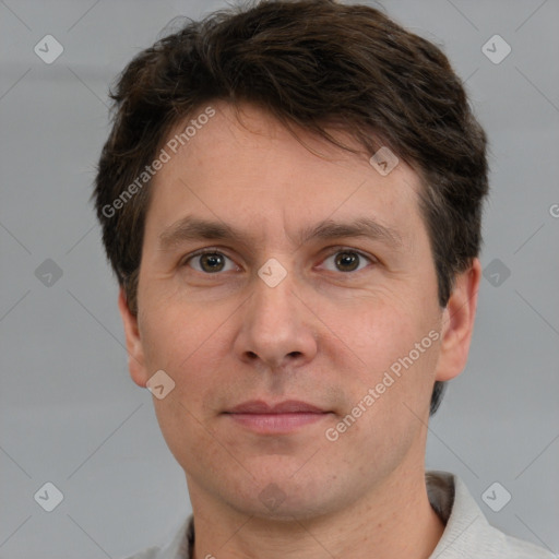 Joyful white adult male with short  brown hair and brown eyes