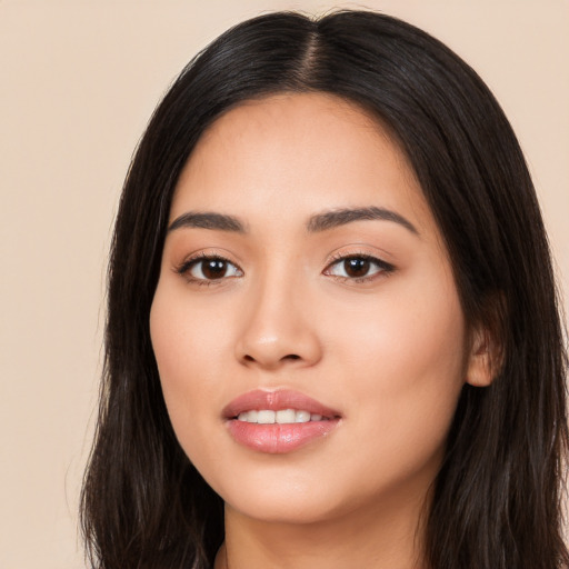 Joyful white young-adult female with long  black hair and brown eyes