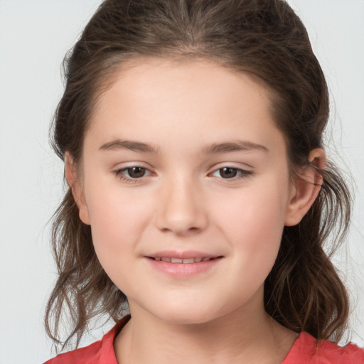 Joyful white child female with medium  brown hair and brown eyes