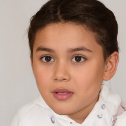 Joyful white child female with short  brown hair and brown eyes