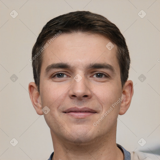 Joyful white young-adult male with short  brown hair and brown eyes