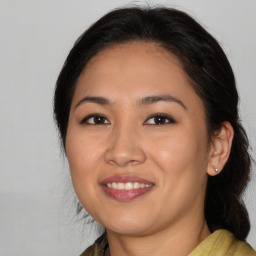 Joyful asian young-adult female with medium  brown hair and brown eyes