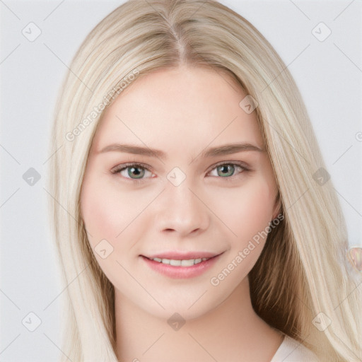 Joyful white young-adult female with long  brown hair and blue eyes