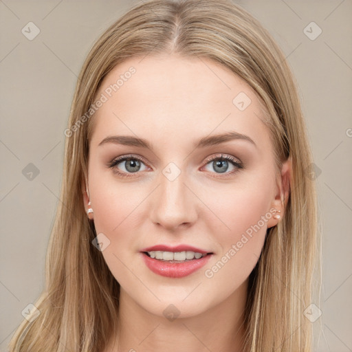 Joyful white young-adult female with long  brown hair and blue eyes