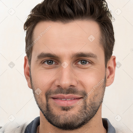 Joyful white young-adult male with short  brown hair and brown eyes