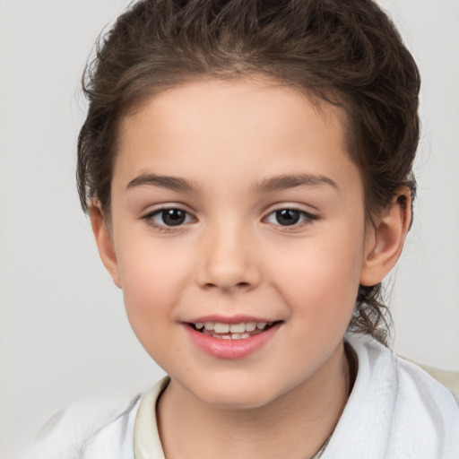 Joyful white child female with medium  brown hair and brown eyes