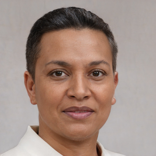 Joyful white adult female with short  brown hair and brown eyes