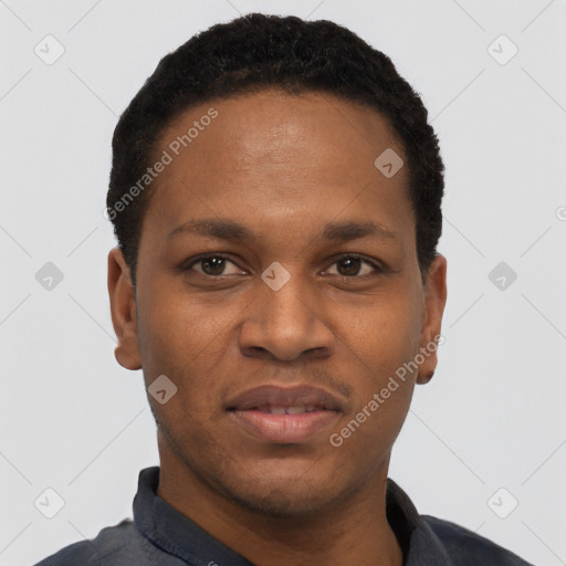 Joyful black young-adult male with short  black hair and brown eyes