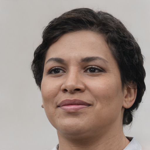 Joyful white adult female with short  brown hair and brown eyes