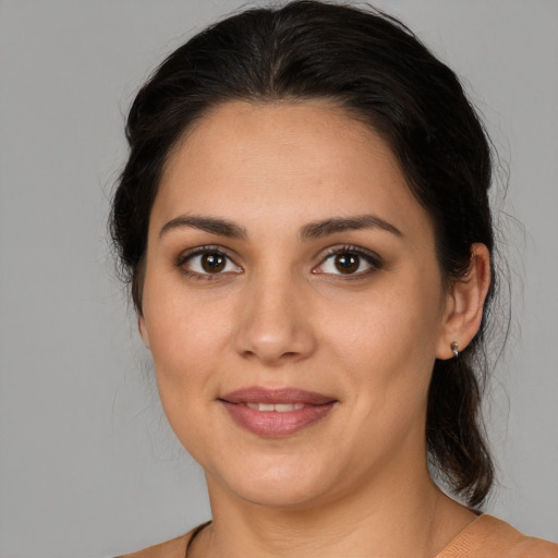 Joyful white young-adult female with medium  brown hair and brown eyes