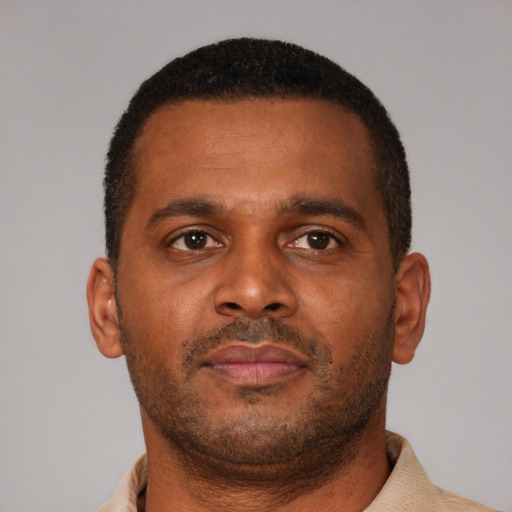 Neutral latino young-adult male with short  brown hair and brown eyes
