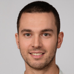 Joyful white young-adult male with short  brown hair and brown eyes