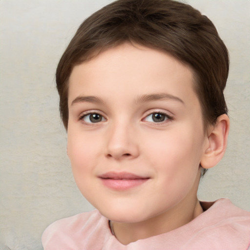 Joyful white child female with short  brown hair and brown eyes