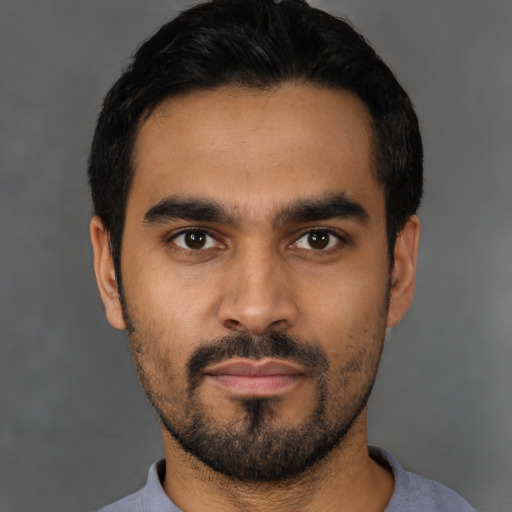 Neutral latino young-adult male with short  black hair and brown eyes