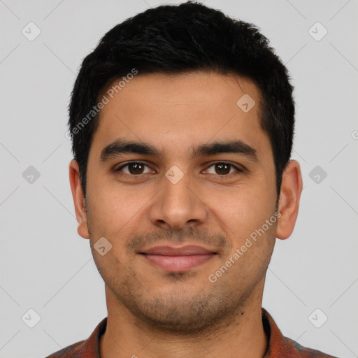 Joyful latino young-adult male with short  brown hair and brown eyes