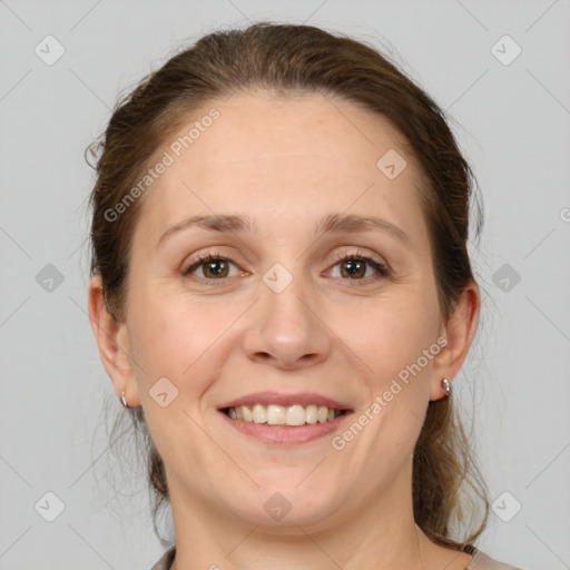 Joyful white adult female with medium  brown hair and grey eyes